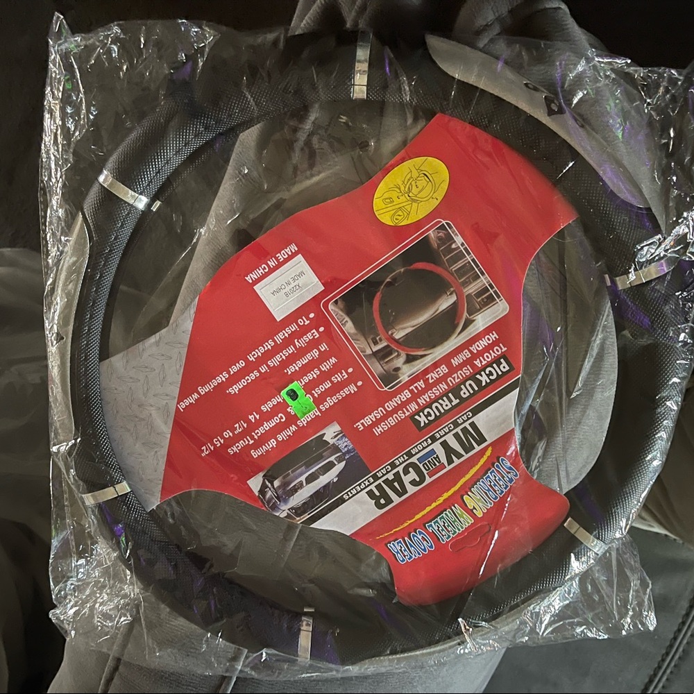 Black and silver steering wheel cover